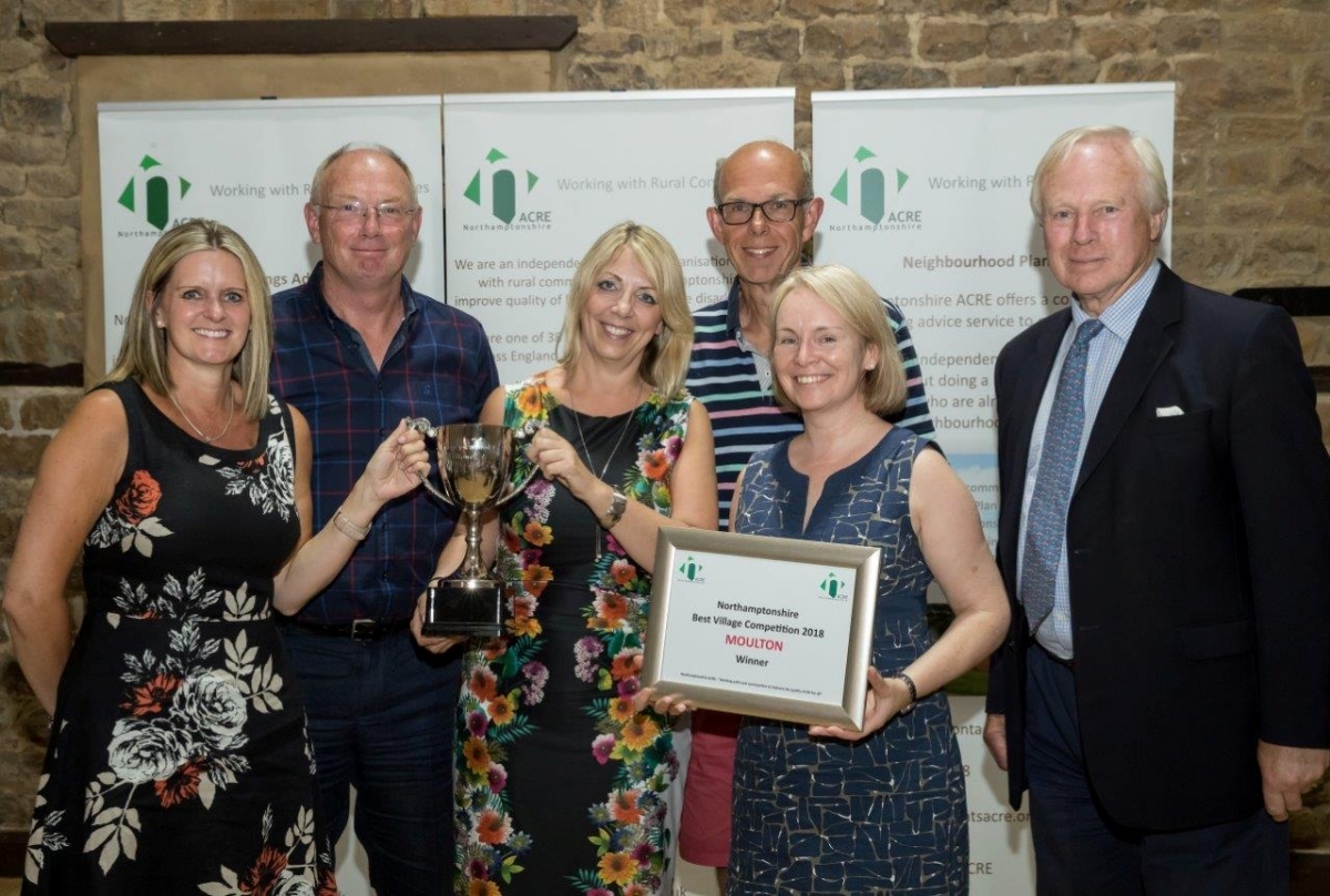 Moulton receiving their Best Village 2018 awards with David Laing